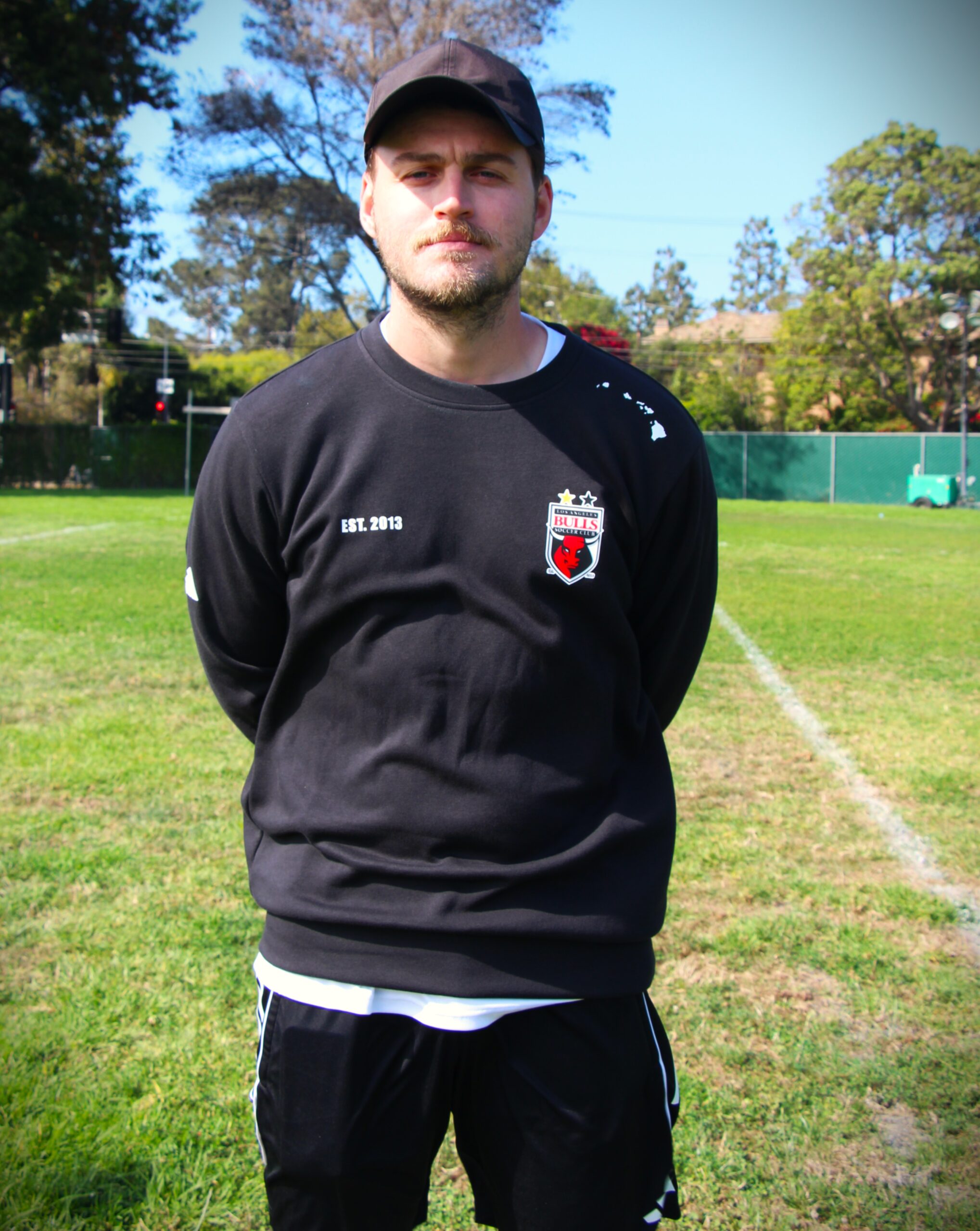 Image of a young male in black LA Bulls sweater