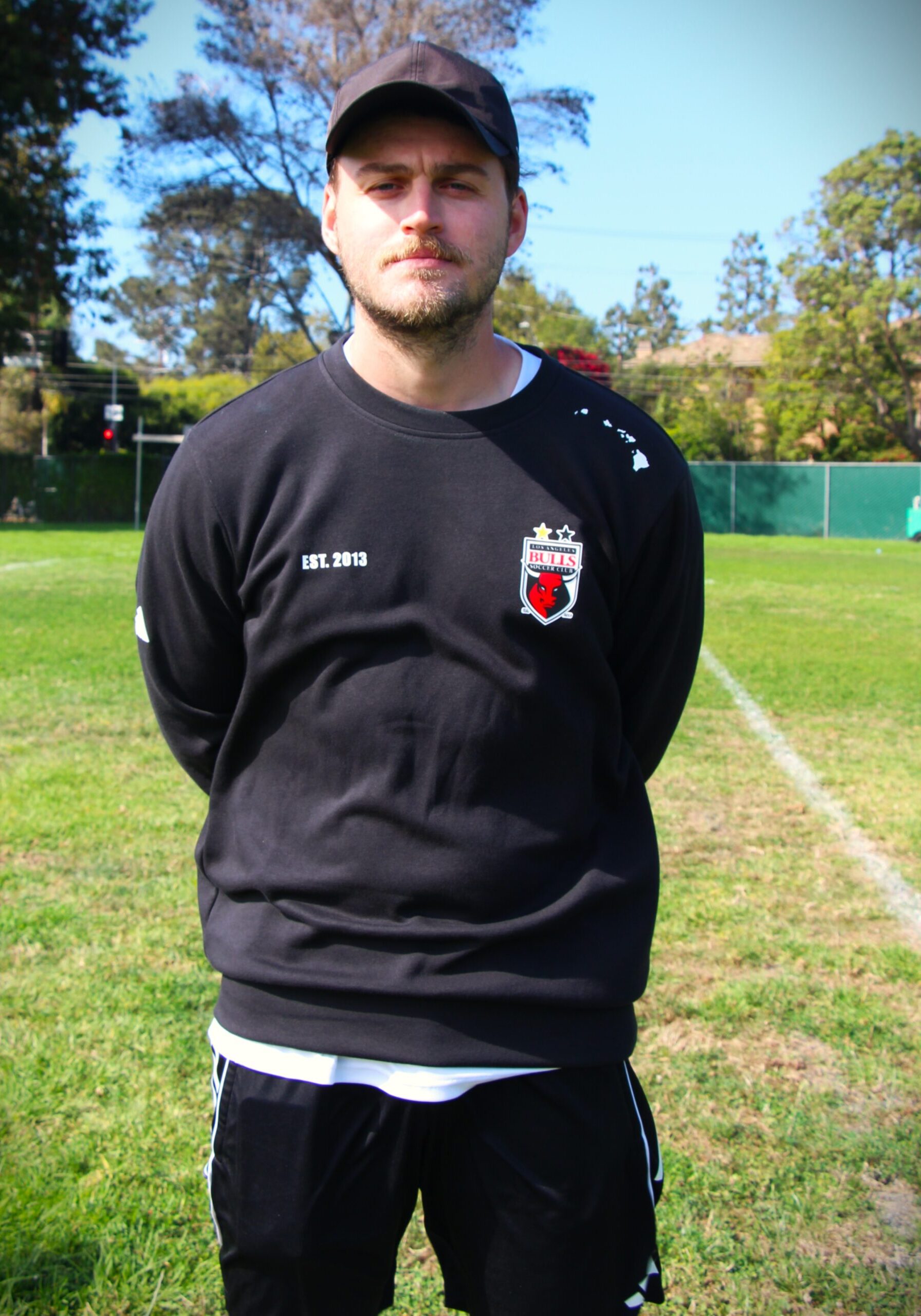 Image of a young male in black LA Bulls sweater