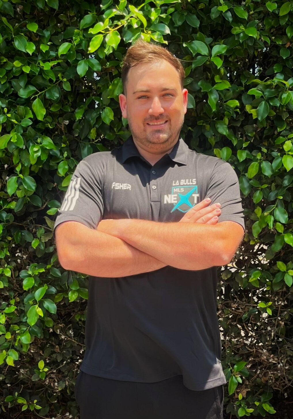 Image of a male in MLS Next logo shirt